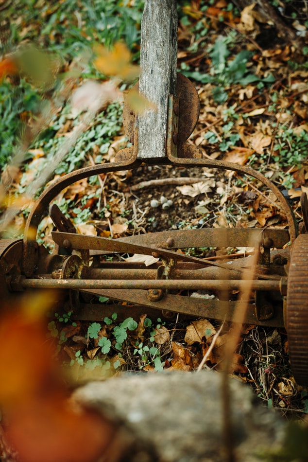 old rusty push lawnmower - green ninja